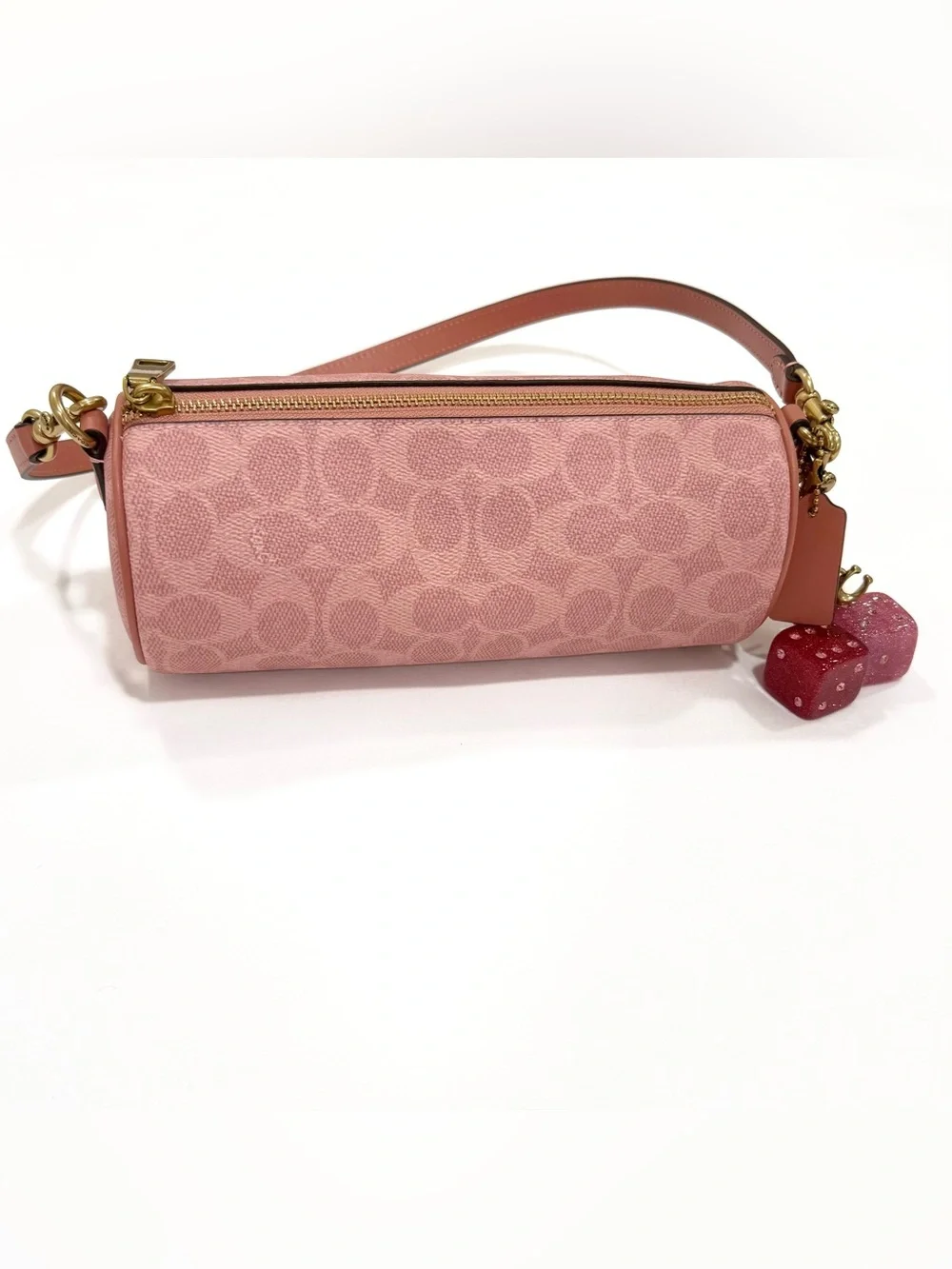 New Coach cylinder barrel bag in melon pink/ brass with signature canvas